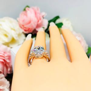 Oval Cubic Zirconia with Four Round Accents Engagement Ring