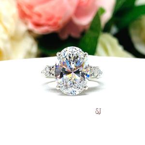 Oval Cubic Zirconia with Four Round Accents Engagement Ring