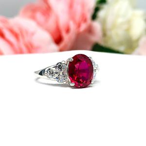 Lab Created Ruby Oval Ring Round CZ Accented Sterling Silver
