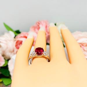 Lab Created Ruby Oval Ring Round CZ Accented Sterling Silver