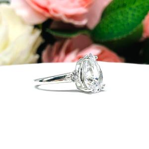 Lab White Sapphire Pear Ring Round Side Stones