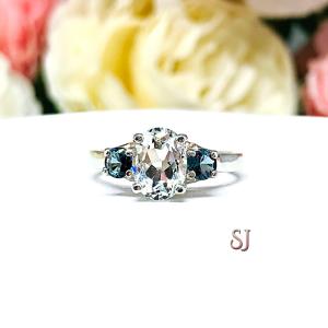 White Topaz 8x6mm Oval with Round London Blue Topaz Ring
