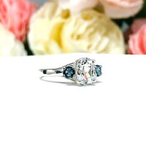 White Topaz 8x6mm Oval with Round London Blue Topaz Ring