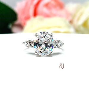 Oval Cubic Zirconia with Four Round Accents Engagement Ring
