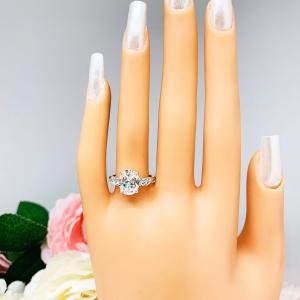 Oval Cubic Zirconia with Four Round Accents Engagement Ring