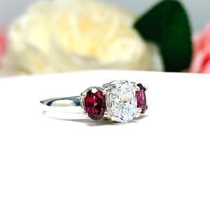 Oval CZ Natural Garnet 3 Stone Engagement Ring - 8x6mm oval center stone - 6x4mm rhodolite garnet - Sterling silver trellis setting