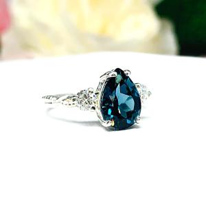 London Blue Topaz Pear Ring - Round moissanite side stones - Sterling silver twist milgrain band