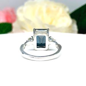 Emerald Cut London Blue Topaz Ring - Moissanite side stones - Sterling Silver twist milgrain band