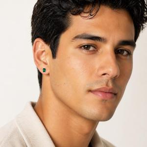 A man wearing 7x5mm emerald cut lab emerald sterling silver stud earrings. Model image for size and styling reference — not a photo of the actual earrings.