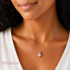 A woman wearing a 10x8mm oval lab white sapphire sterling silver pendant necklace. Model image for size and styling reference — not a photo of the actual necklace.