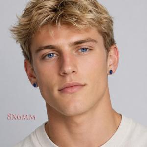 A man wearing 8x6mm oval lab blue sapphire oval sterling silver stud earrings. Model image for size and styling reference — not a photo of the actual earrings.