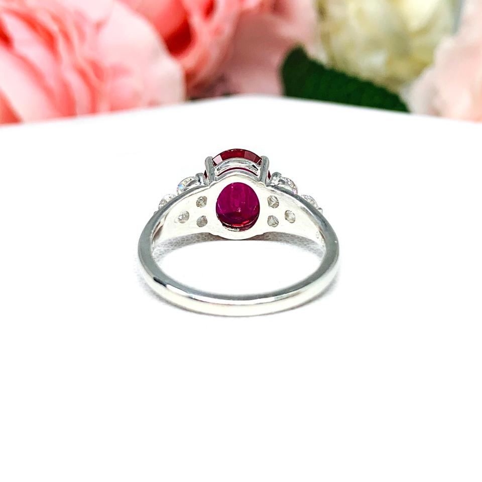 Lab Created Ruby Oval Ring Round CZ Accented Sterling Silver