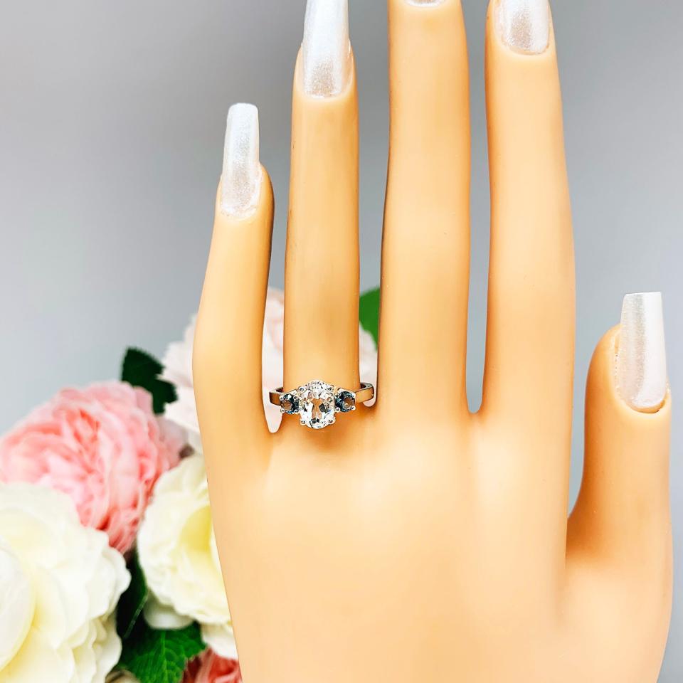 White Topaz 8x6mm Oval with Round London Blue Topaz Ring