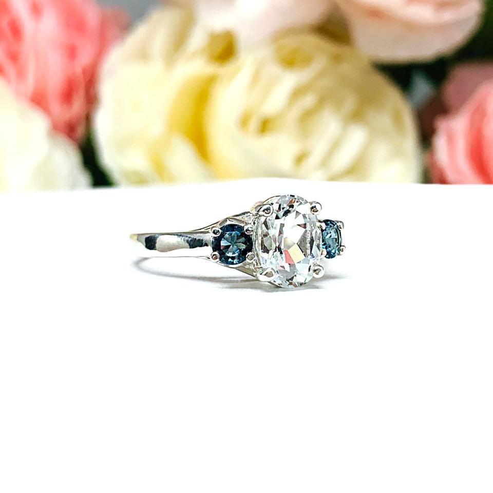 White Topaz 8x6mm Oval with Round London Blue Topaz Ring