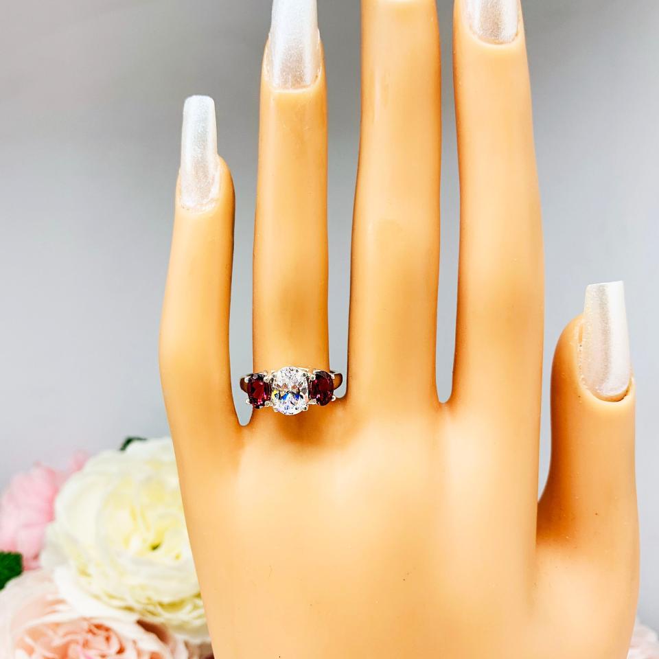 Oval CZ Natural Garnet 3 Stone Engagement Ring - 8x6mm oval center stone - 6x4mm rhodolite garnet - Sterling silver trellis setting