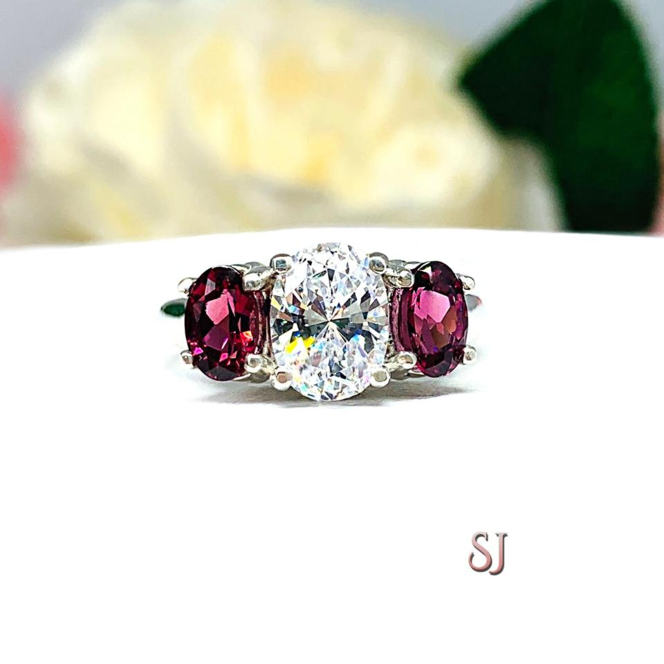Oval CZ Natural Garnet 3 Stone Engagement Ring - 8x6mm oval center stone - 6x4mm rhodolite garnet - Sterling silver trellis setting