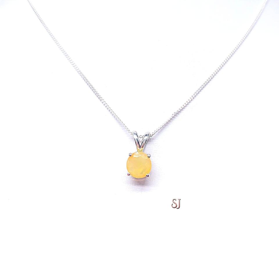 Sterling silver 8mm round Ethiopian opal pendant necklace displayed on a white background. The opal has a translucent gold base.