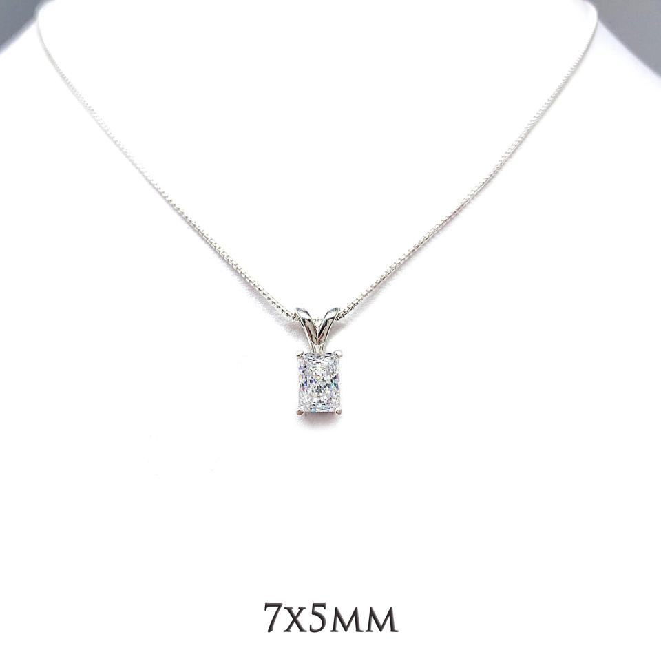 Faceted radiant CZ pendant in sterling silver setting, suspended from a smooth silver chain, displayed against a white background, available in eight size options, shown in 7x5mm size.