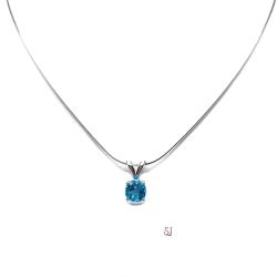 Sterling silver necklace featuring a natural 6mm round-cut swiss blue topaz pendant in a four-prong setting, shown on a sterling silver chain.