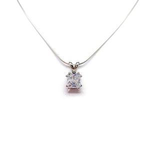 A sparkling princess cut cz in a double prong sterling silver setting, suspended from a delicate chain. The necklace is set against a white background.