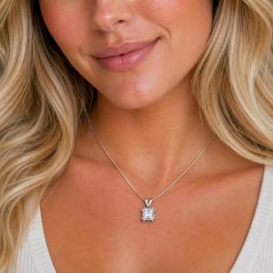 A woman wearing a princess cz pendant suspended from a sterling silver chain. Model image for size and styling reference — not a photo of the actual necklace.