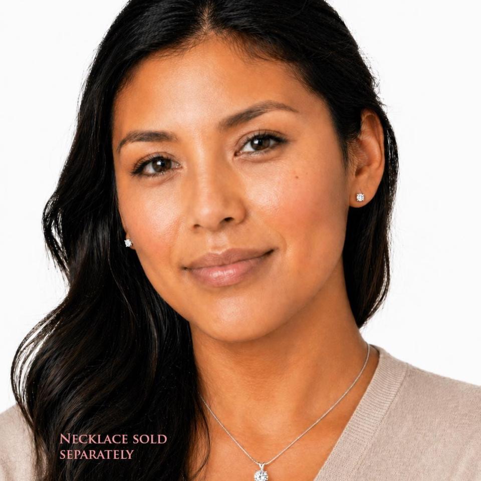 A woman wearing mixed-brilliant round-cut lab white sapphire stud earrings and matching pendant necklace. 'NECKLACE SOLD SEPARATELY' appears in pink text in the image. Model image for size and styling reference — not a photo of the actual earrings.
